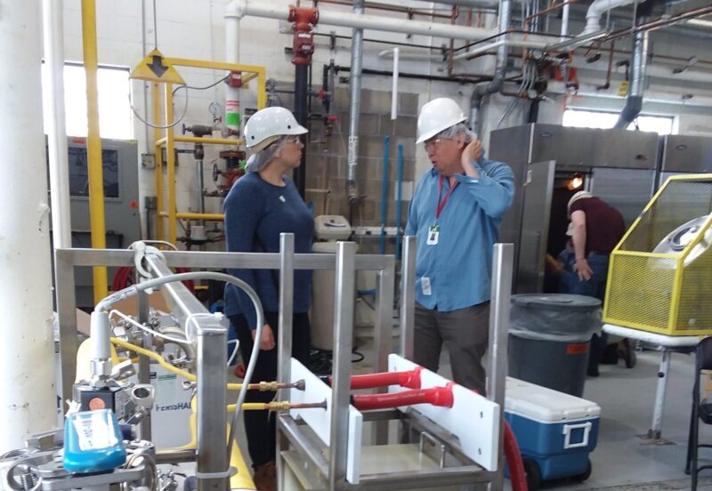 IFS Cohort #5 Sous vide testing Two people standing in a lab talking