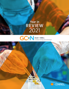 Image of the cover of the GCxN Year in Review 2021 cover, which shows a picture of a scientist