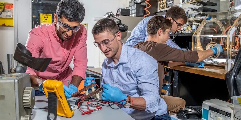 Antora received technical and financial assistance through the GCxN program Four scientists working in a lab